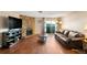 Living room features hardwood floors and a stone fireplace at 10150 E Virginia Ave # 2-205, Denver, CO 80247