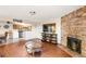 Open living area with stone fireplace and kitchen at 10150 E Virginia Ave # 2-205, Denver, CO 80247