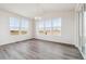 Spacious dining area with large windows and wood-look flooring at 24955 E 41St Ave, Aurora, CO 80019