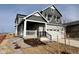 Two-story house with gray siding, white trim, landscaping, and a two-car garage at 24955 E 41St Ave, Aurora, CO 80019