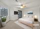 Bright bedroom with balcony access and ceiling fan at 5550 W 80Th Pl # 20, Arvada, CO 80003