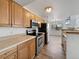 Kitchen features stainless steel appliances and wood cabinets at 5550 W 80Th Pl # 20, Arvada, CO 80003