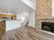 Open living room with kitchen, fireplace and loft at 5550 W 80Th Pl # 20, Arvada, CO 80003