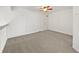 Open loft area with carpeted floor and ceiling fan at 5550 W 80Th Pl # 20, Arvada, CO 80003
