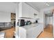 White kitchen cabinets and granite countertops at 17662 E Loyola Dr # 2132L, Aurora, CO 80013