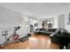 Living room with sectional sofa and hardwood floors at 17662 E Loyola Dr # 2132L, Aurora, CO 80013