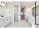 Double vanity bathroom with a view of the hallway at 1742 Morgan Dr, Erie, CO 80516