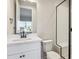 Bathroom with white vanity, quartz countertop, and shower at 1742 Morgan Dr, Erie, CO 80516