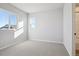 Well-lit bedroom with neutral walls and carpet at 1742 Morgan Dr, Erie, CO 80516