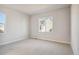 Bright bedroom with neutral walls and carpeting at 1742 Morgan Dr, Erie, CO 80516