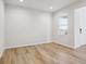 Bright foyer with hardwood floors and view to the great room at 1742 Morgan Dr, Erie, CO 80516