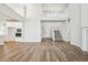 Two-story great room with hardwood floors, staircase, and open concept design at 1742 Morgan Dr, Erie, CO 80516