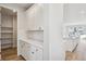 Walk-in pantry with ample shelving and white cabinetry at 1742 Morgan Dr, Erie, CO 80516