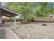 Backyard with firepit, patio, and mature shade tree at 8467 W 62 Pl, Arvada, CO 80004