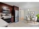 Modern kitchen with stainless steel appliances and breakfast nook at 8467 W 62 Pl, Arvada, CO 80004