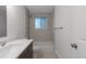 Bathroom with shower/tub combo and updated vanity at 8467 W 62 Pl, Arvada, CO 80004