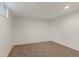Spacious finished basement room with neutral colored carpet at 8467 W 62 Pl, Arvada, CO 80004