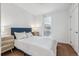 Bright bedroom with wood floors and modern decor at 3575 Chestnut Pl # 605, Denver, CO 80216