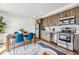 Modern kitchen with wood cabinets and stainless steel appliances at 3575 Chestnut Pl # 605, Denver, CO 80216