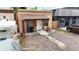 Front exterior view of house with covered porch and walkway at 1952 S Acoma St, Denver, CO 80223