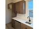 Kitchen with gray cabinets, white quartz countertops, and a dishwasher at 5626 W 142 Ave, Broomfield, CO 80020