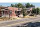 Three brick houses for sale with front porches and landscaping at 160 S Cherokee St, Denver, CO 80223