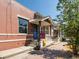 Brick house with front porch and For Sale sign at 160 S Cherokee St, Denver, CO 80223