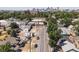 Aerial view of residential neighborhood with city skyline in the distance at 160 S Cherokee St, Denver, CO 80223