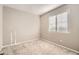 Simple bedroom with carpeted floor and window coverings at 17207 E Exposition Dr, Aurora, CO 80017