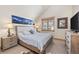 Bright bedroom with king bed and ensuite bathroom access at 518 S Ridge St # 518, Breckenridge, CO 80424