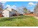 Large backyard with grassy area and home exterior view at 11102 Zephyr St, Westminster, CO 80021