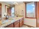 Bathroom with double sinks and granite countertops at 11102 Zephyr St, Westminster, CO 80021