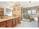 Elegant bathroom with granite countertops and a walk-in shower at 11102 Zephyr St, Westminster, CO 80021