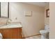 Basement bathroom with granite countertop vanity and tile floor at 11102 Zephyr St, Westminster, CO 80021