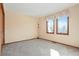 Well-lit bedroom featuring neutral walls and carpet at 11102 Zephyr St, Westminster, CO 80021