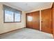 Bedroom with double closets and a window at 11102 Zephyr St, Westminster, CO 80021