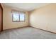 Simple bedroom with window and carpet at 11102 Zephyr St, Westminster, CO 80021