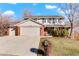 Two-story house with brick and siding, attached two-car garage, and landscaped yard at 11102 Zephyr St, Westminster, CO 80021