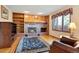 Gathering room features a brick fireplace and built-in shelving at 11102 Zephyr St, Westminster, CO 80021