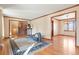 Spacious living room with hardwood floors, large windows, and access to dining area at 11102 Zephyr St, Westminster, CO 80021
