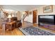 Living room with hardwood floors, a large TV, and comfortable seating at 11102 Zephyr St, Westminster, CO 80021