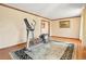 Home gym in living room with hardwood floors and large windows at 11102 Zephyr St, Westminster, CO 80021