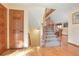 Hardwood staircase with wooden railing leading to the upper level at 11102 Zephyr St, Westminster, CO 80021