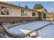 Large backyard with a patio and snow-covered ground at 4446 S Xenia St, Denver, CO 80237