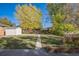 Landscaped backyard with shed and walkway at 1646 S Winona Ct, Denver, CO 80219