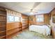 Basement bedroom with built-in shelving at 1646 S Winona Ct, Denver, CO 80219