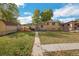 Spacious backyard with shed and pathway at 1646 S Winona Ct, Denver, CO 80219