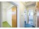 Hallway with access to bedrooms and bathroom at 1646 S Winona Ct, Denver, CO 80219
