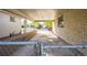 Covered carport with access through chain link fence at 1646 S Winona Ct, Denver, CO 80219