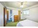Bedroom with wood dresser and carpet at 1646 S Winona Ct, Denver, CO 80219